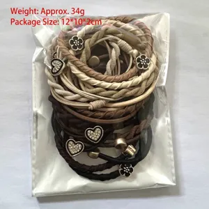 Detailed view of 20pcs elastic hair ties set with heart and flower accents in package