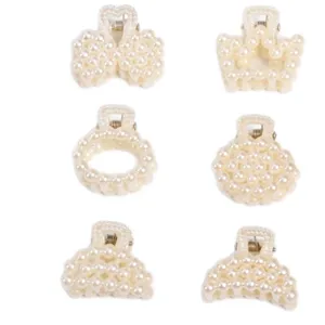 Set of small elegant pearl hair claw clips in various shapes on white background