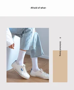 Comfortable white cotton mid-tube socks paired with classic canvas shoes for daily casual wear.