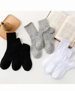 Detail view of classic black, grey, and white casual socks, neatly displayed for style.