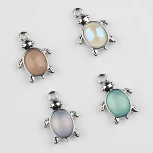 Close-up detail view of colorful turtle alloy jewelry charms, perfect for DIY crafting.