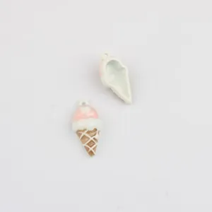 Close-up detail of cute ice cream cone enamel alloy pendant charm for DIY jewelry making access.