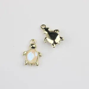 Gold turtle pendant charm, alloy DIY jewelry making accessory, close up detailed view.