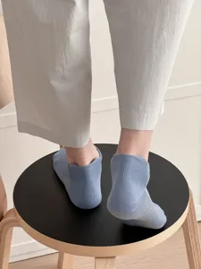 Men low cut breathable mesh socks detail view featuring back tab light blue style