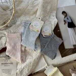 Detailed view of women thin mesh polka dot mid-calf socks, breathable spring summer style socks.