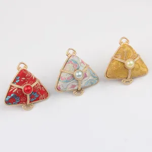 Detail view of traditional Chinese brocade zongzi pendant and DIY keychain accessory.
