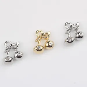 Detail shot of cute cherry alloy rhinestone charms for DIY jewelry making necklaces.