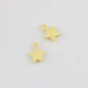 Detail view of yellow alloy five-pointed star charm pendant for DIY jewelry accessories.