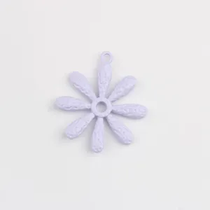 Close-up of a light purple alloy daisy flower pendant, showing detailed texture.