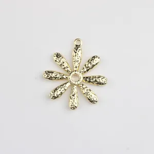 Gold metal daisy flower charm detail shot, perfect for DIY jewelry making and necklace design.