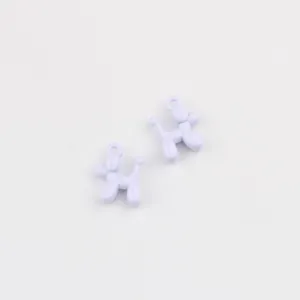 Close-up view of light purple alloy mini balloon dog charms, perfect for DIY crafts.