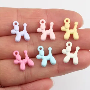 Close-up detail shot of cute colorful alloy balloon dog charms for DIY jewelry making.