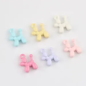 Close-up detail of colorful enamel alloy balloon dog charms for DIY jewelry crafting.