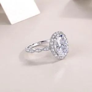 Exquisite detail view of the oval moissanite halo ring with pave twisted silver band.