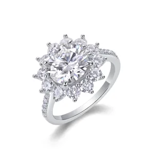 Close-up detail view of sterling silver moissanite halo ring with sparkling paved stones.