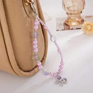 Bijou de téléphone élégant en perles violettes avec papillon en cristal pour sacs