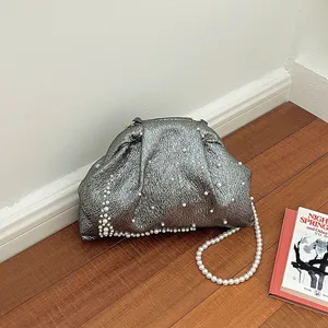 Stylish metallic grey clutch bag with pearl chain and elegant beaded details for evening events.