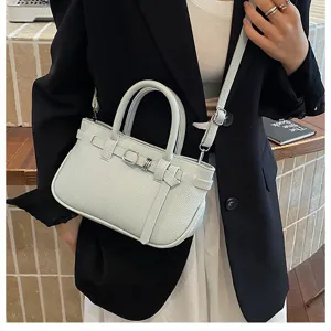 Chique grijze mini handtas met handvat en schouderband, elegante mode-accessoire voor dames.