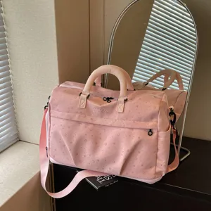 Stylish pink large capacity travel duffel bag with star moon print and shoulder strap