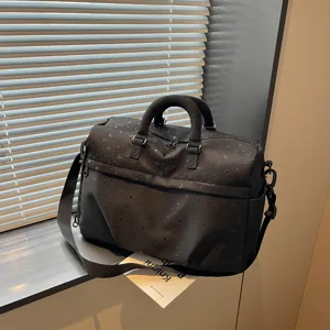 Black large capacity travel duffel bag with star moon pattern, stylish shoulder messenger bag.