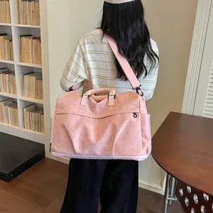 Large capacity pink travel duffel bag with star moon pattern for women, stylish shoulder bag.