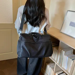 Detailed view of casual travel duffel bag with star moon pattern in daily lifestyle scene.
