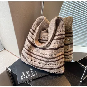 Detailed view of the knit tote bag featuring a chic striped design and comfortable strap.