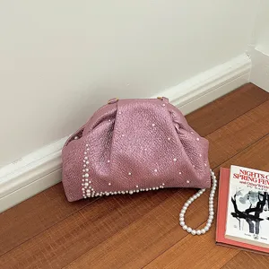 Pink metallic clutch bag with pearl decorations, elegant evening shoulder bag for women.