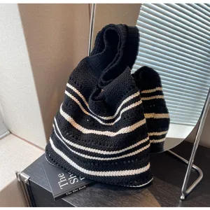 Black and white striped knit tote bag detail, featuring soft texture and casual daily style.