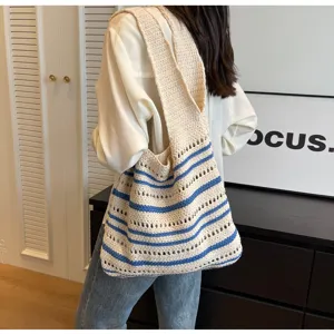 Detailed view of the casual crochet striped tote bag, stylish beach shoulder bag for women.