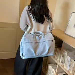 Lightweight fashion large capacity handbag shoulder travel bag detail view showing design.