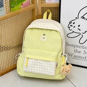 Sac à dos d'école en toile style japonais mignon avec broderie de pomme et joli pendentif.