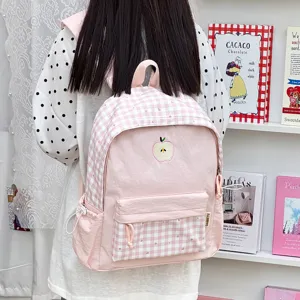 Sac à dos rose à carreaux avec broderie de pomme, cartable élégant pour un usage quotidien.