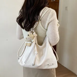 Women versatile convertible shoulder bag large capacity casual backpack with cute bear.