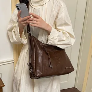 Detailed view of the dark brown PU leather multi-functional casual shoulder and crossbody bag.