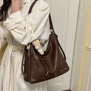 Stylish dark brown PU leather shoulder bag for women, large capacity casual hobo crossbody bag.