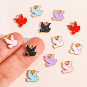 Close-up view of multi-color enamel peace dove bird charms, ideal for DIY jewelry making.