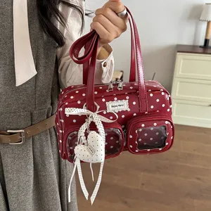 Womens red polka dot handbag stylish underarm bag commuter shoulder bag with pearl heart charm.