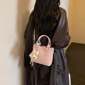 Bolso tipo cubo de cuero rosa estilo coreano para mujer, bandolera versátil y elegante.