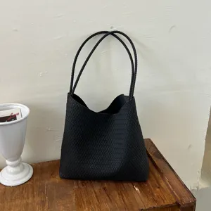 Black woven shoulder tote bag for women, large capacity vintage commuting handbag style.