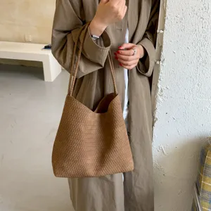 Brown woven leather tote bag detailed view, vintage large capacity shoulder bag for daily commute.