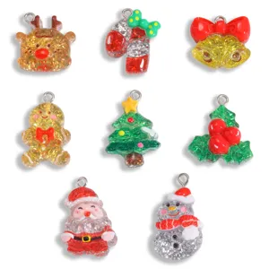 Close up of Christmas resin charms with glitter details for DIY jewelry making pendants.