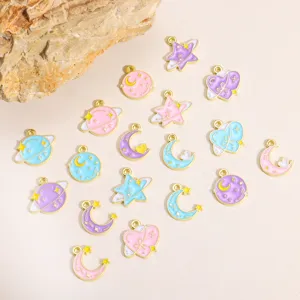 Detailed shot of cute starry sky enamel charms, celestial alloy pendants for DIY jewelry making.