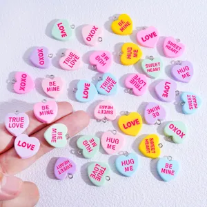 Colorful resin heart charms with cute love text, metal loops for DIY necklaces and keychains.