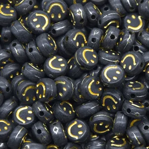 Black and gold smiley face loose beads for DIY phone charms, bracelets, and jewelry making.