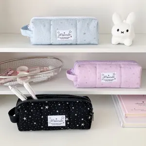 Detailed view of canvas star pattern pencil case lifestyle display stationery storage bag.