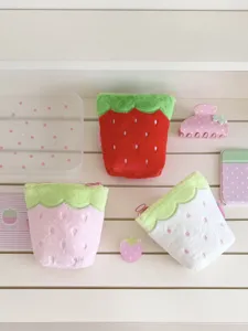 Cute strawberry plush pencil case set, soft cosmetic pouch with sweet design for students.
