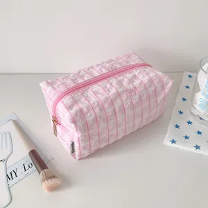 Detailed view of the pink plaid makeup bag with cute bow embroidery, large capacity aesthetic pouch.
