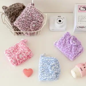 Plush leopard print mini coin purse wallet detail shot, cute soft card holder with snap closure.