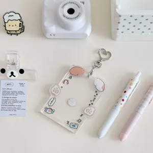 Cute transparent acrylic photocard holder with adorable animal charms and keyring.
